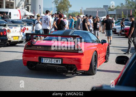 Rear view of a stunning mid-engine V6 Honda NSX. It is red with carbon fiber spoiler and rear diffuser Stock Photo