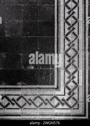 In shades of gray: A black and white photo unveils the intricate beauty and timeless elegance of tiled patterns. Stock Photo
