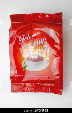 Close up of plastic package Teh Celup Sosro 2 in 1 with sugar isolated on white background. Front view. Stock Photo