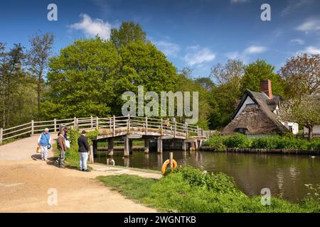 UK, England, Suffolk, Flatford, visitors at bridge over River Stour at Bridge Cottage Stock Photo