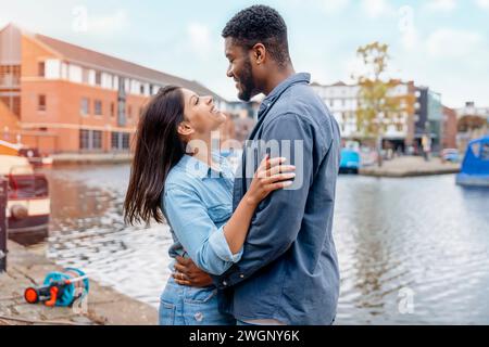 couple walking and hugging on the quays, pier,   looking at yacht, sailboat, boat, having a fun, date.  Lifestyle concept Stock Photo