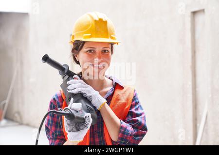 Smiling female skilled engineer wearing workwear Stock Photo