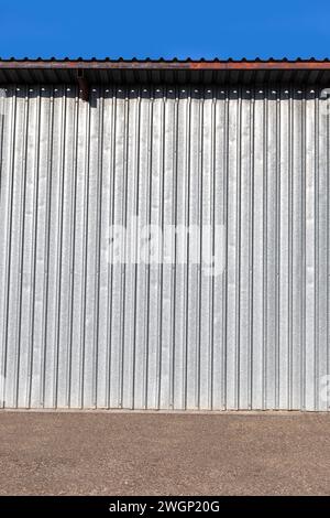 corrugated aluminum warehouse side wall with roof Stock Photo