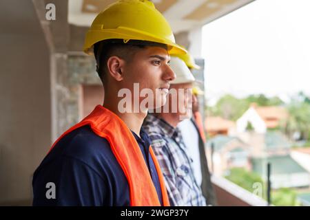 Young construction worker wearing safety workwear Stock Photo
