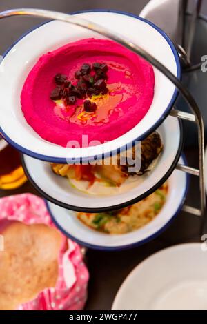 Three meze dishes served on rack Stock Photo