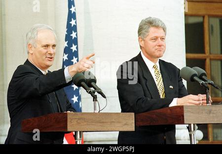 File photo dated 01/12/95 of Ireland's Prime Minister John Bruton makes a point during a speech with President Clinton outside the Goverment Building Dublin. Former Irish premier John Bruton has died aged 76 following a long illness, his family has confirmed. Issue date: Tuesday February 6, 2024. Stock Photo