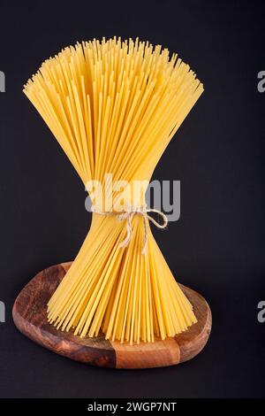Bunch of spaghetti on black background Stock Photo
