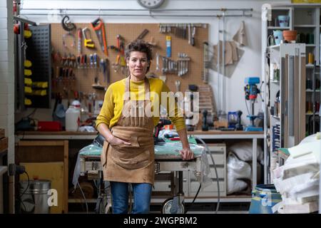 Female upholstery Portrait in her workshop Stock Photo