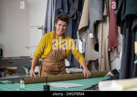 Female upholstery Portrait in her workshop Stock Photo
