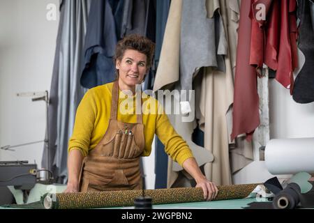 Female upholstery Portrait in her workshop Stock Photo