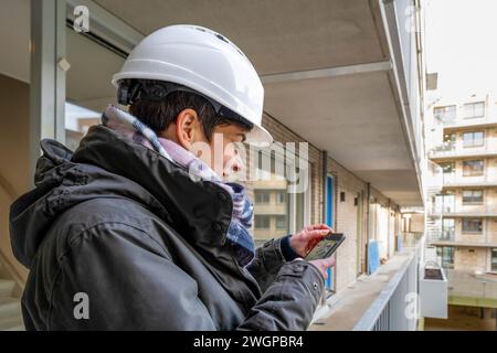 Female Construction manager walking around site Stock Photo