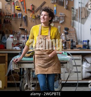 Female upholstery Portrait in her workshop Stock Photo
