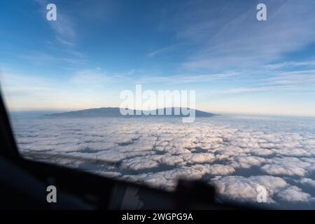 Cockpit view of an aircraft in flight over the clouds Stock Photo