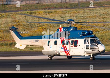 Heli-Union Eurocopter AS-332L1 Super Puma departing on a flight to an oil rig in the Mediterranean in the early morning Stock Photo