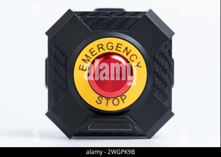 Red emergency stop button isolated close up view Stock Photo