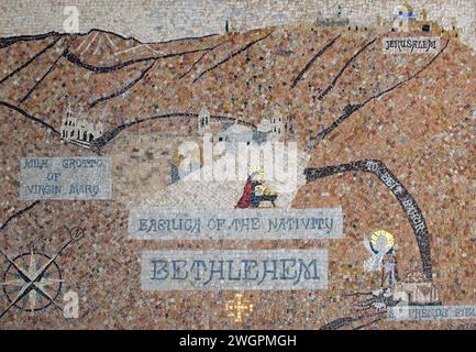Mosaic map of Bethlehem hangs on the wall in the courtyard of the Church of Saint Catherine, near the Church of Nativity in Bethlehem in the Palestini Stock Photo