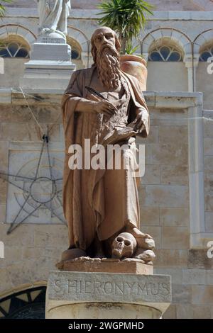 A statue of St. Jerome outside St. Catherine's Church in Bethlehem, Israel Stock Photo