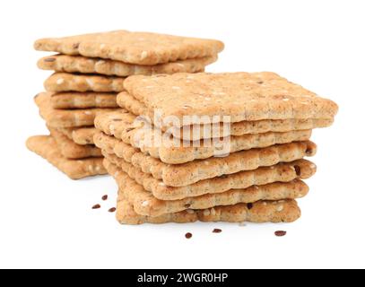 Stacks of cereal crackers with flax and sesame seeds isolated on white ...