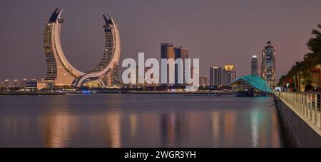 Lusail skyline Lusail city, Qatar including Katara Towers project from Lusail marina night shoot .Construction industry concept. Stock Photo