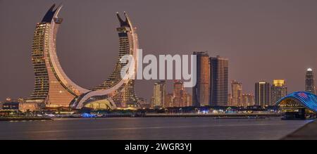 Lusail skyline Lusail city, Qatar including Katara Towers project from Lusail marina night shoot .Construction industry concept. Stock Photo