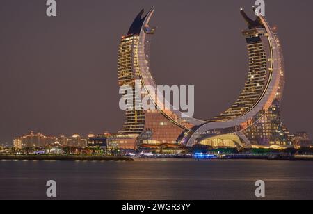 Lusail skyline Lusail city, Qatar including Katara Towers project from Lusail marina night shoot .Construction industry concept. Stock Photo