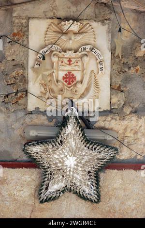 Christmas star above the entrance to the cave in Shepherd's Fields in Beit Sahour near Bethlehem, Israel Stock Photo
