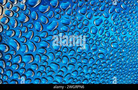 Abstract background of water drops. Drops of liquid on the glass. Stock Photo