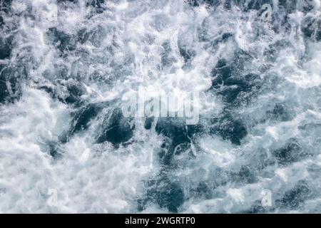Ocean surface background with waves and foam. Top view. Stock Photo