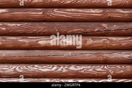 Texture of old wooden fence made of rounded boards. Stock Photo