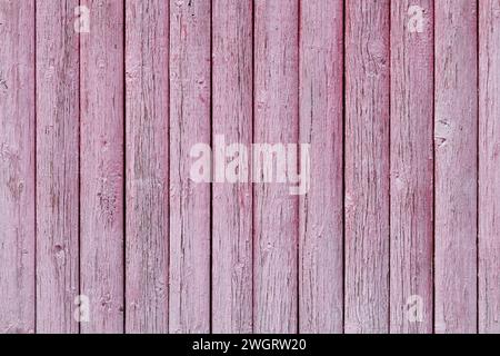 Texture old wooden fence with peeled pink paint Stock Photo
