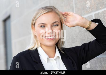 Business woman with long blond hair Stock Photo