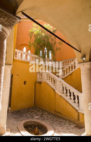 Interior with courtyard and staircase of Château Musée Grimaldi, ancient castle tower now contains municipal gallery in Cagnes-sur-Mer. French Riviera town near Nice. France. (135) Stock Photo