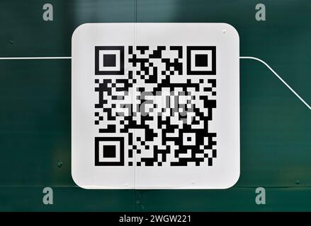 QR code on green metallic panel Stock Photo