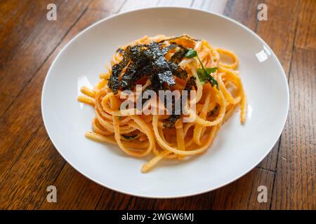 Mentaiko spaghetti on white dish. Stock Photo