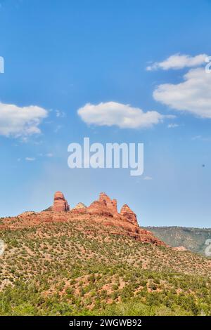 Sedona Red Rock Formations with Blue Sky and Clouds Stock Photo