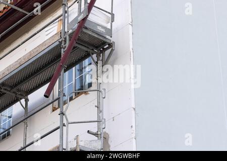 Renovation of the facade of an old building with External thermal insulation cladding Stock Photo