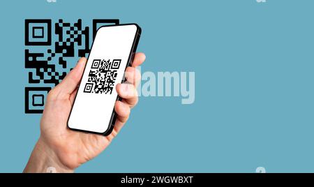Scanning QR code with mobile phone app. QRcode scanner on smartphone screen in hand. Banner background Stock Photo