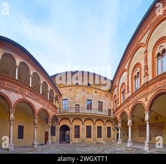 CREMONA, ITALY - APRIL 6, 2022: The richly decorated frescoed medieval courtyard of Palazzo Fodri (Fodri Palace), located in Cremona old town, Italy Stock Photo