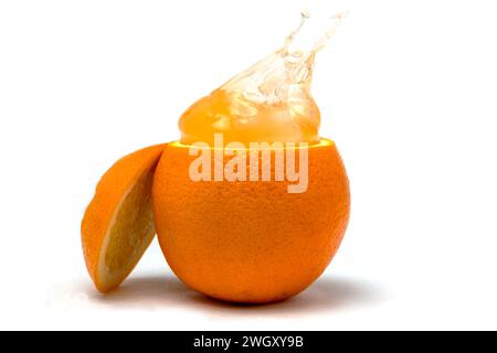 Orange juice splash isolated on white. Stock Photo