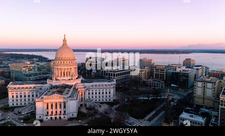 Aerial photograph of sunset over Madison, Wisconsin on a beautiful winter evening. Lady Forward is the statue atop the Wisconsin State Capitol buildin Stock Photo