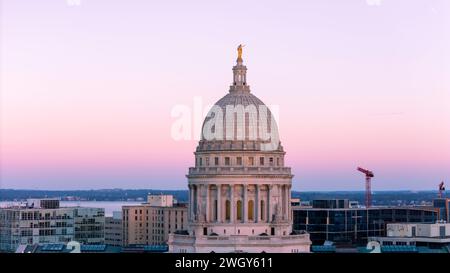 Aerial photograph of sunset over Madison, Wisconsin on a beautiful winter evening. Lady Forward is the statue atop the Wisconsin State Capitol buildin Stock Photo