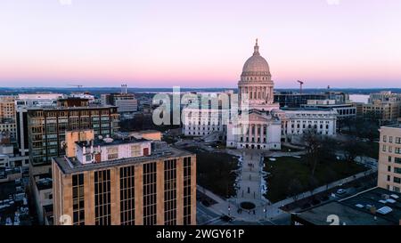 Aerial photograph of sunset over Madison, Wisconsin on a beautiful winter evening. Lady Forward is the statue atop the Wisconsin State Capitol buildin Stock Photo