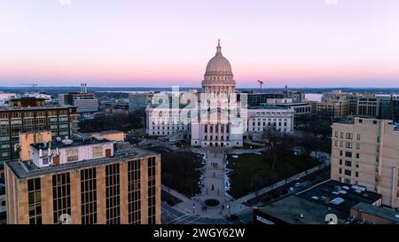 Aerial photograph of sunset over Madison, Wisconsin on a beautiful winter evening. Lady Forward is the statue atop the Wisconsin State Capitol buildin Stock Photo