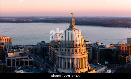 Aerial photograph of sunset over Madison, Wisconsin on a beautiful winter evening. Lady Forward is the statue atop the Wisconsin State Capitol buildin Stock Photo