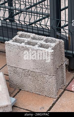 Concrete cinder block construction material outside on a street Stock Photo