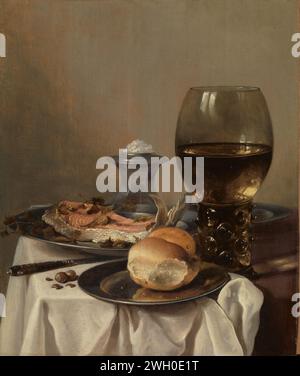 Still Life with a Salt, Pieter Claesz, c. 1640 - c. 1645 painting Still life with a bread and a fish on tin plates. On the right a Roemer, at the back a salt barrel. There are also a knife and a few hazelnuts on the table.  panel. oil paint (paint) painting laid table as still life. breakfast piece (Dutch: 'ontbijtje'). glass, rummer. salt-cellar, salt-shaker. salt Stock Photo