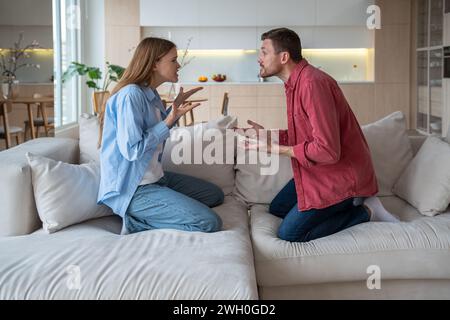 Reproachful wife shouting at delinquent husband. Misunderstanding and ...