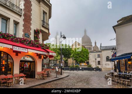 Paris, France - May 14, 2023 : city skyline time lapse of architecture building on Montmartre street and Sacre Coeur Stock Photo