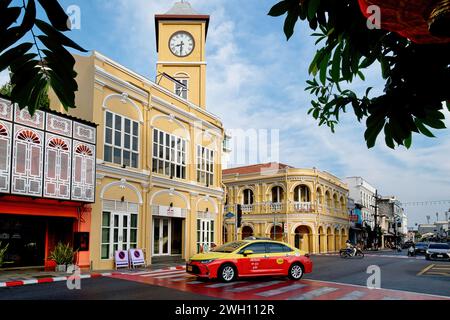 View of the Old Town area of Phuket Town, Phuket, Thailand, with its landmark Promthep Clocktower and (opposite) the Peranakannitat Museum Stock Photo