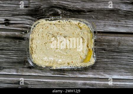 Tahini Tahina which is a Middle Eastern condiment made from toasted ground hulled sesame, served by itself (as a dip), with spices and herbs, Seafood Stock Photo